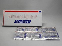A box and a strip of Naltrexone 50mg Tabs